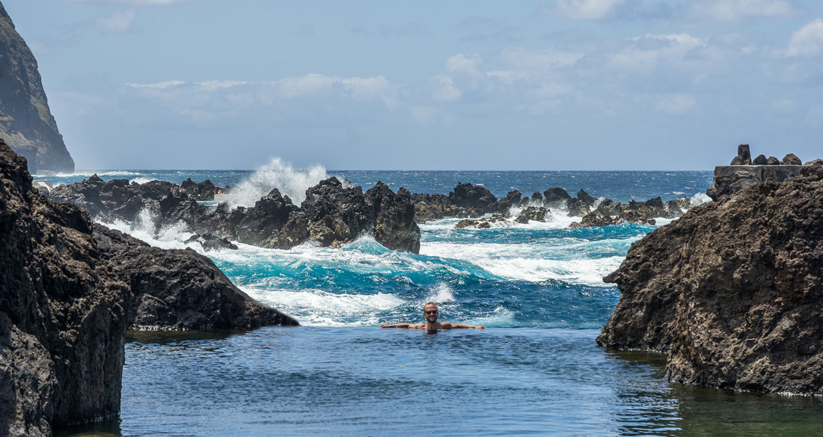 infinity pool with the rough sea in the back
