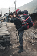 the porter of another trekking couple. Most porters carry the luggage of two trekkers. Many customers seem to not worry about this at all...