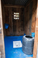 a luxury 5-star-toilet: very clean, a shiny blue floor, a rubbish bin in the back and a water bucket to flush :-)