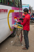 portable street vendor who moves from bus to bus and sells to the people inside