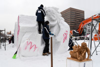 at the snow contest teams from different countries can build a sculpture from one huge block of snow. In the front is the model. This was team Thailand. We wonder where they practice... 